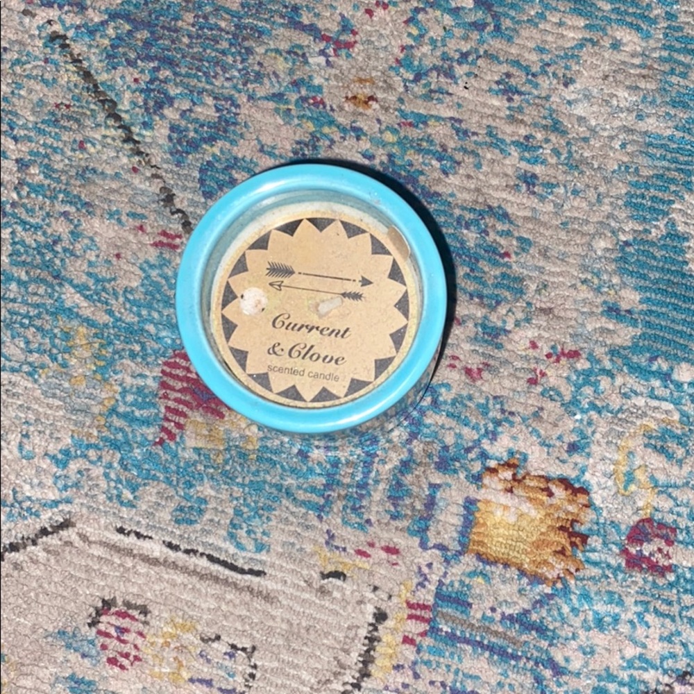 A blue smell good Current Glove scented candle